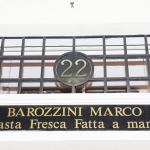 Insegna del banco della Gastronomia Barozzini